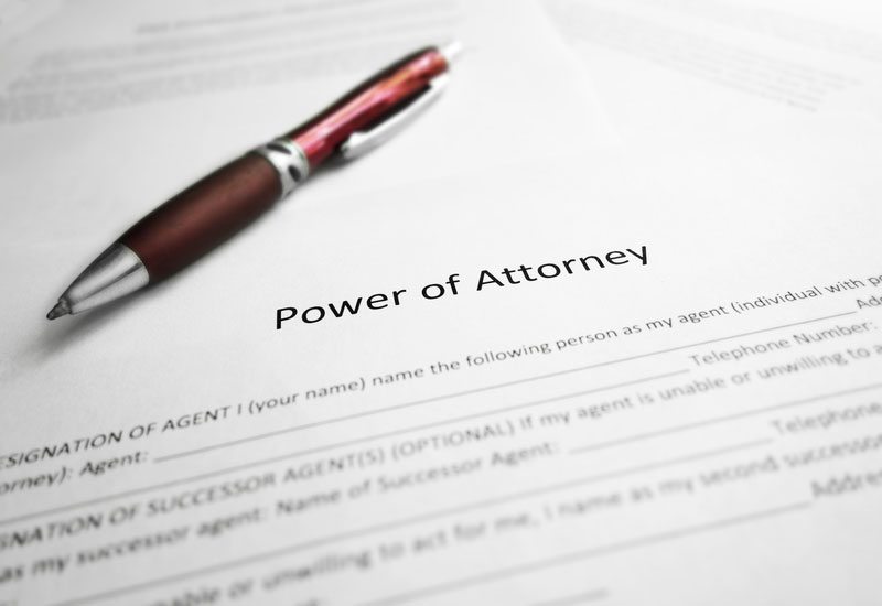 Power of Attorney legal document and pen